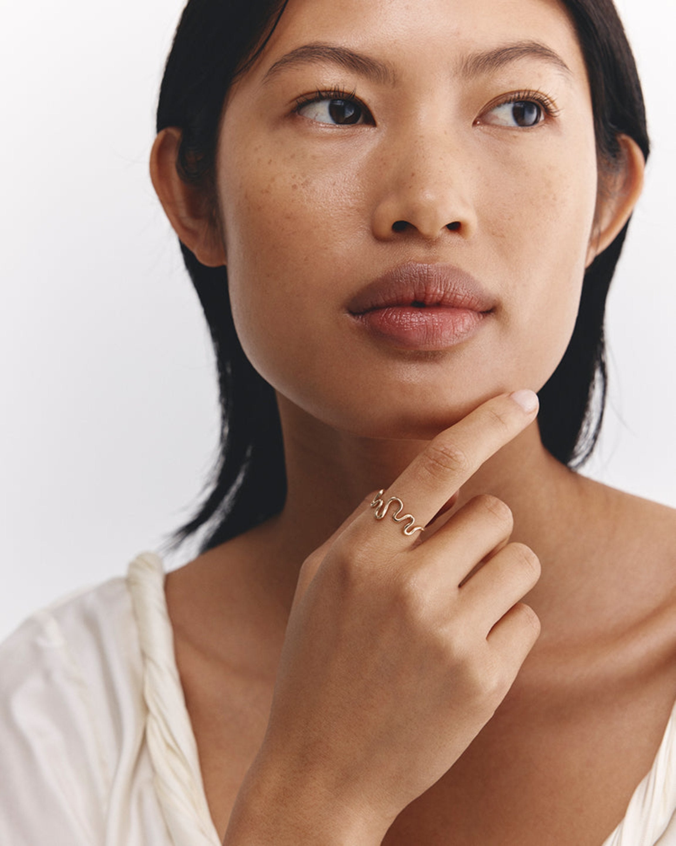 Model wears Rumi Ring in yellow gold.