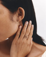 Model wears Rumi Ring set in yellow gold.