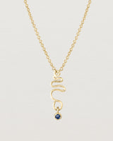 Front on deep etched image of a yellow gold necklace with birthstone charms.