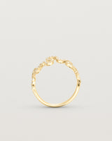 Standing deep etched image of a yellow gold ring with a whirl of 68 diamonds.