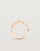 Standing deep etched image of a rose gold ring with a whirl of 68 diamonds.