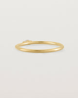 Fine yellow gold stacking ring featuring a white marquise centre diamond