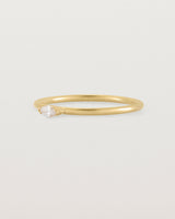 Fine yellow gold stacking ring featuring a white marquise centre diamond