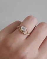 front on deep etched video of a yellow gold  engagement ring with a oval diamond stone