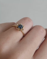 Video on hand of a Australian Teal Sapphire solitaire engagement ring. 