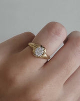 video on hand of a yellow gold solitaire engagement ring